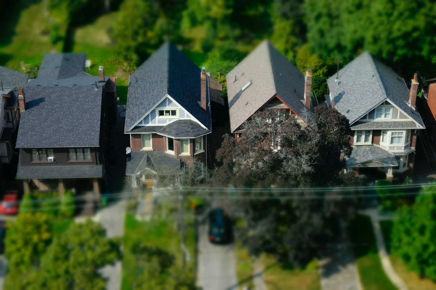 Birdseye view of 4 home roofs in Ottawa.